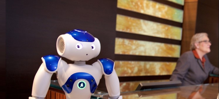AI-powered robot concierge at hotel front desk, ready to assist guests with information and recommendations.
