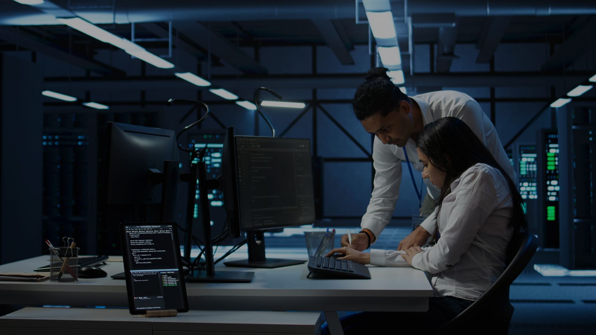 Two professionals discussing the positive impact of AI on their workload and enterprise efficiency.